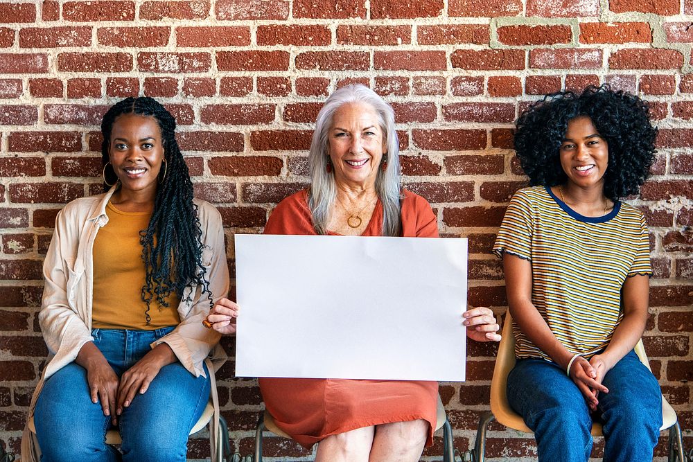 Diverse women showing blank posters template