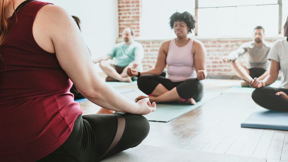 People meditating in a yoga | Premium Photo - rawpixel