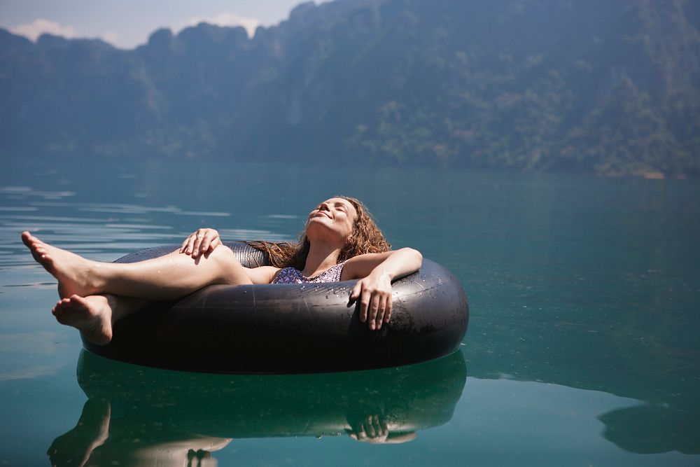 Woman relaxing on a floating ring