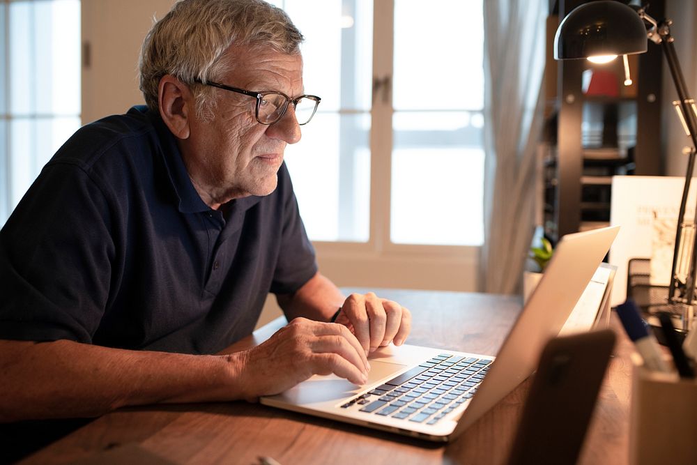 Senior man working on a laptop