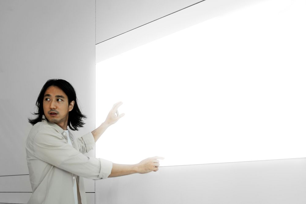 Professor presenting on a large white screen