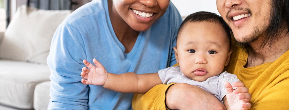 Happy multiracial parents with son social media banner