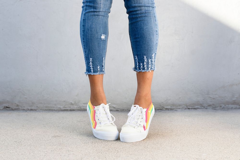 White canvas sneakers rainbow stripes women&rsquo;s shoes apparel shoot