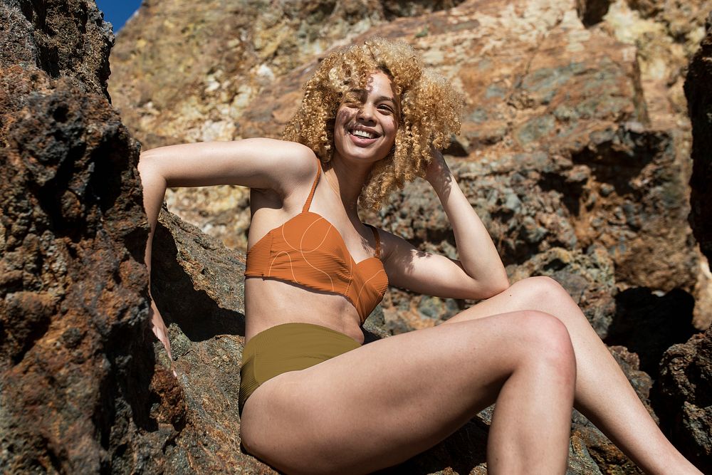 Confident woman in bikini posing outdoor shoot