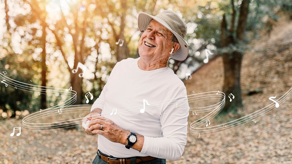 Retired man enjoying music psd in the middle of the forest 