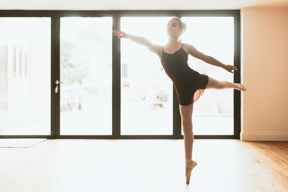 Ballerina background, young girl doing releve pose