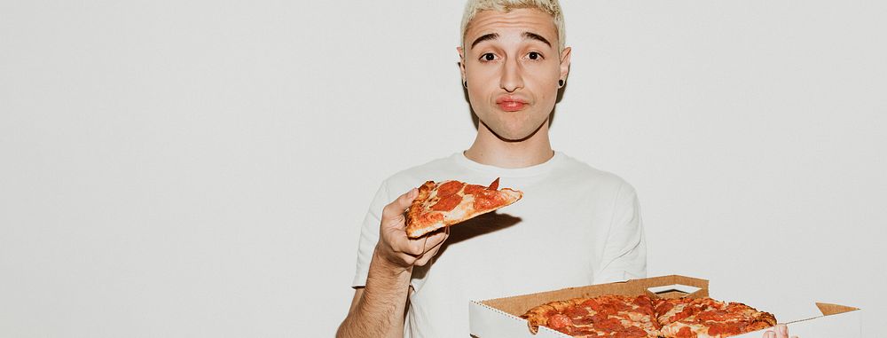 A man having a pepperoni pizza