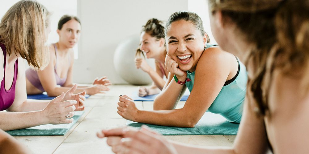 Group of cheerful women in yoga class