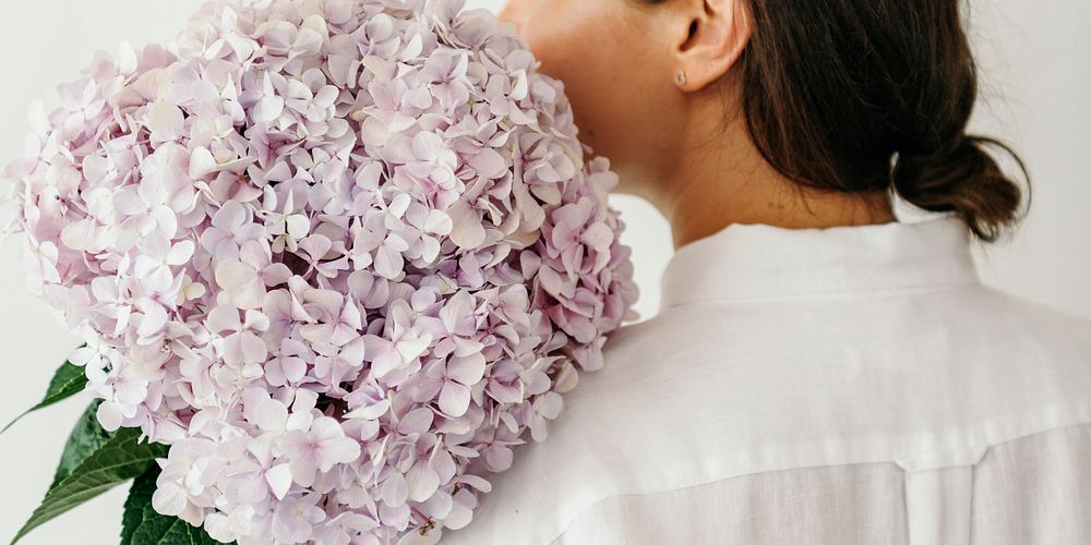 Woman holding a bouquet of hydrangea