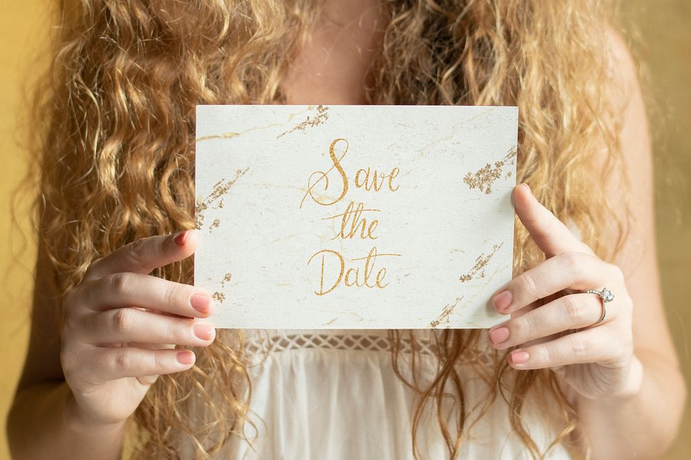 Blond woman with an invitation card