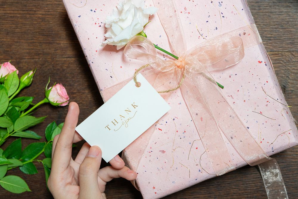 Pink gift box with a card