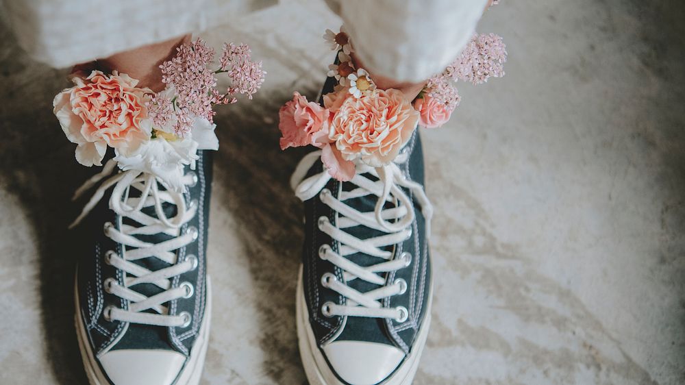 Woman wearing shoes with flowers