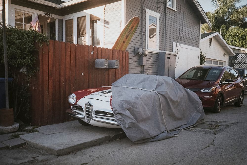 Vintage car parked in a quiet American neighborhood 