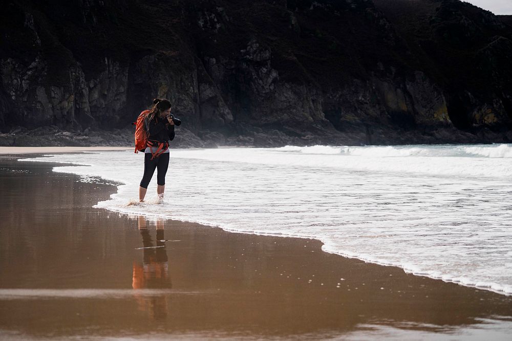 Female photographer at Plemont Bay, Isle of Jersey