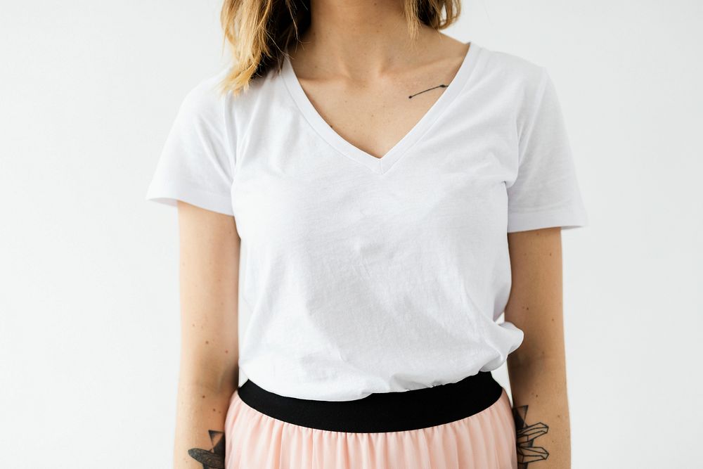 Tattooed woman in a white t-shirt