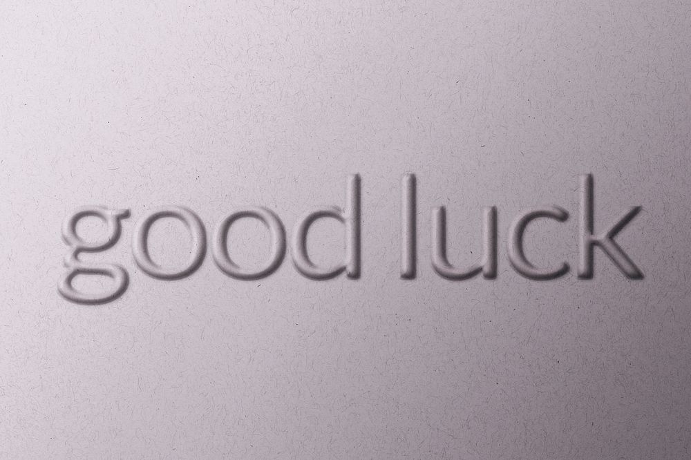 Good luck wish word emboss typography on paper texture