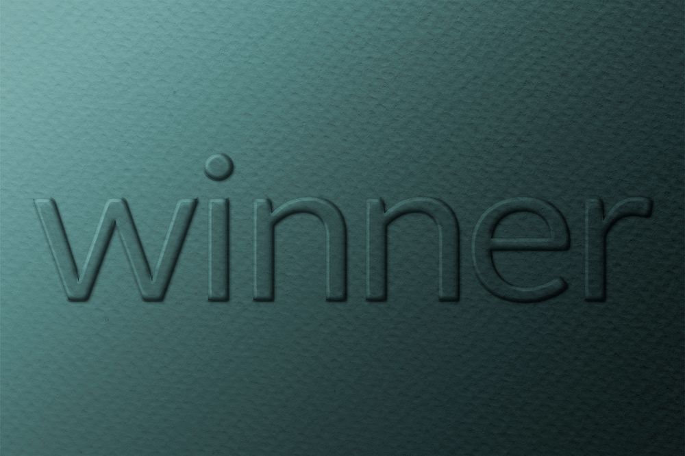 Winner word embossed typography on paper texture