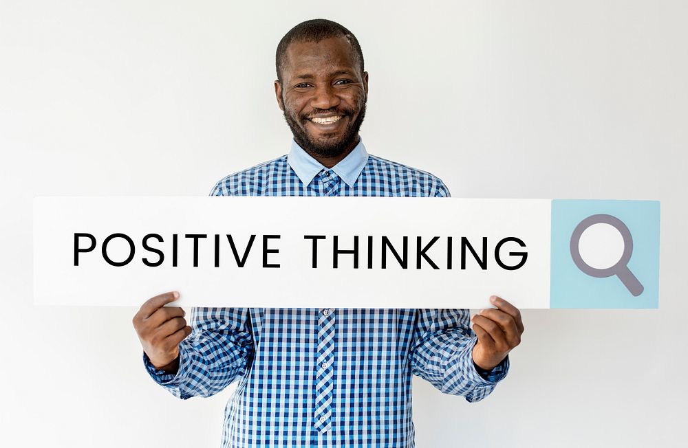 People holding and showing the positive thinking word