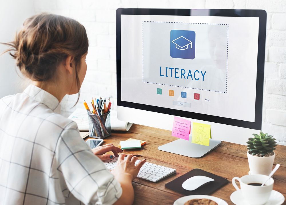 Woman working on computer network graphic lverlay