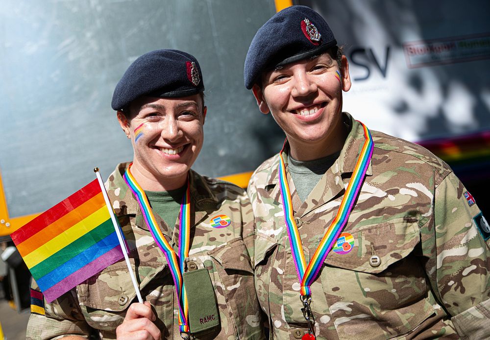 Soldiers showing rainbow flag, August 24, 2019, Manchester, UK. Original public domain image from Flickr