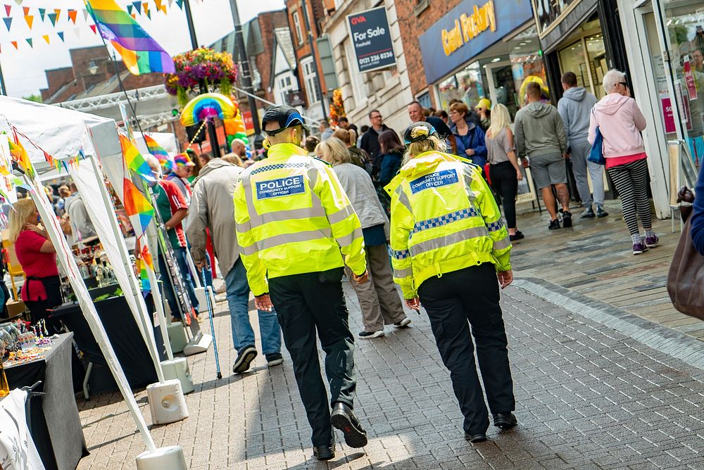 Police officers walking in town, July 20, 2019, Congleton, UK. Original public domain image from Flickr