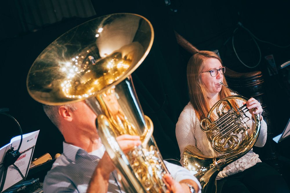 Musician playing brass instrument, October 15, 2019, UK. Original public domain image from Flickr