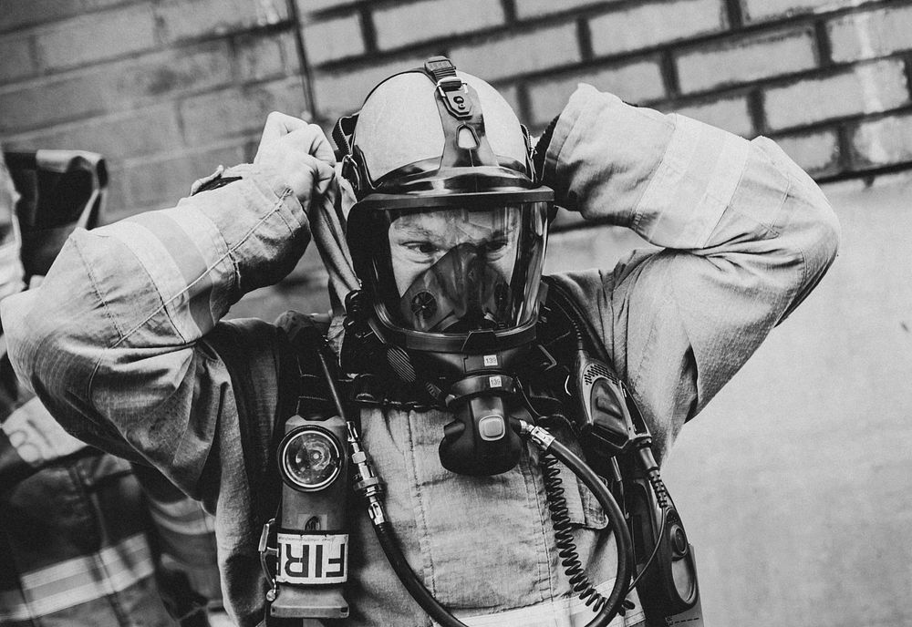 Firefighter wearing protective mask, December 14, 2020, Cheshire, UK. Original public domain image from Flickr