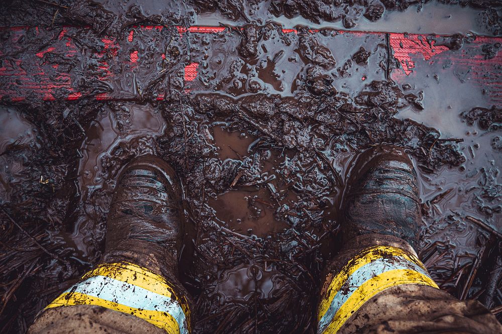 Firefighter boots on dirt. Original public domain image from Flickr