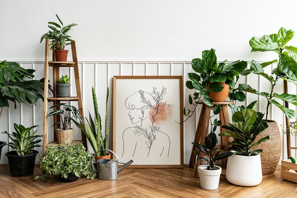 Picture frame mockup psd with line art by a houseplant corner on a parquet floor