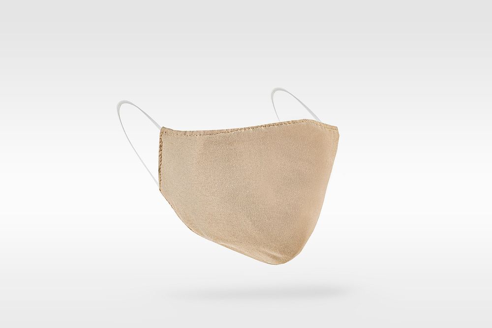 Beige fabric face mask on a gray  background