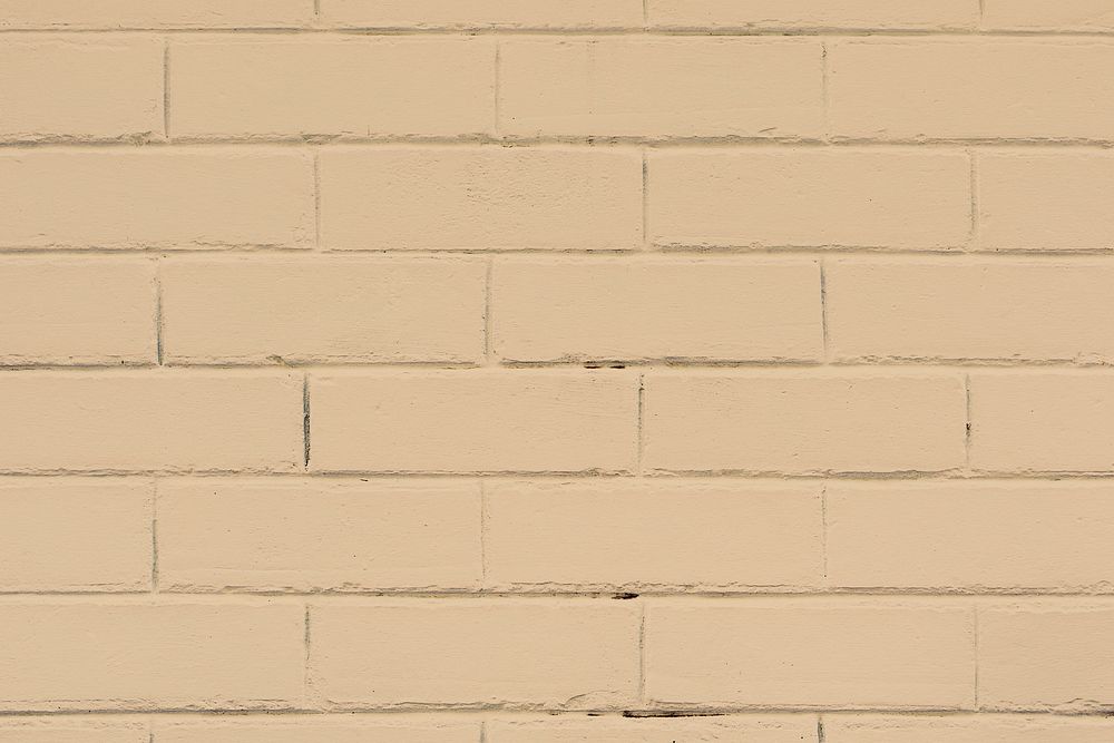 Beige textured brick wall background