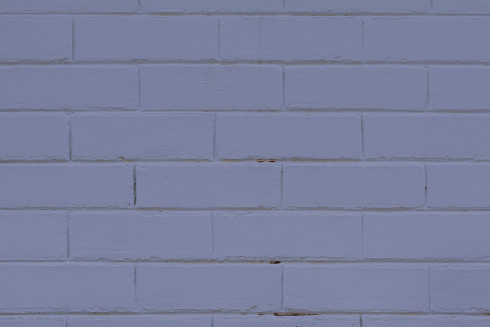 Purple textured brick wall background
