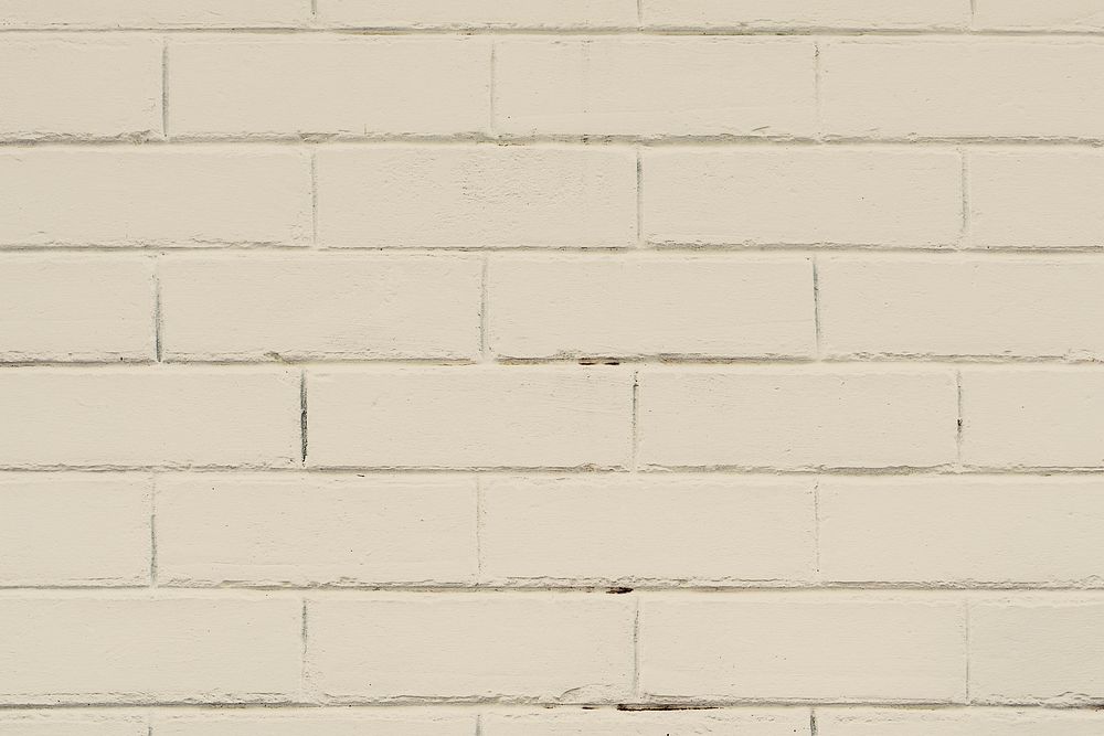 Beige textured brick wall background