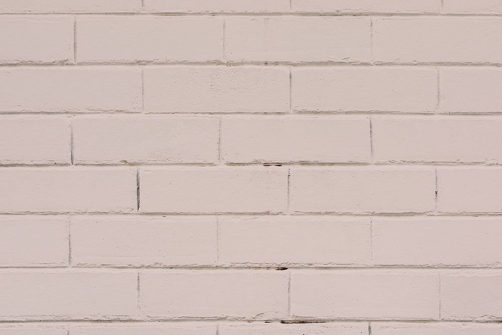 Nude textured brick wall background