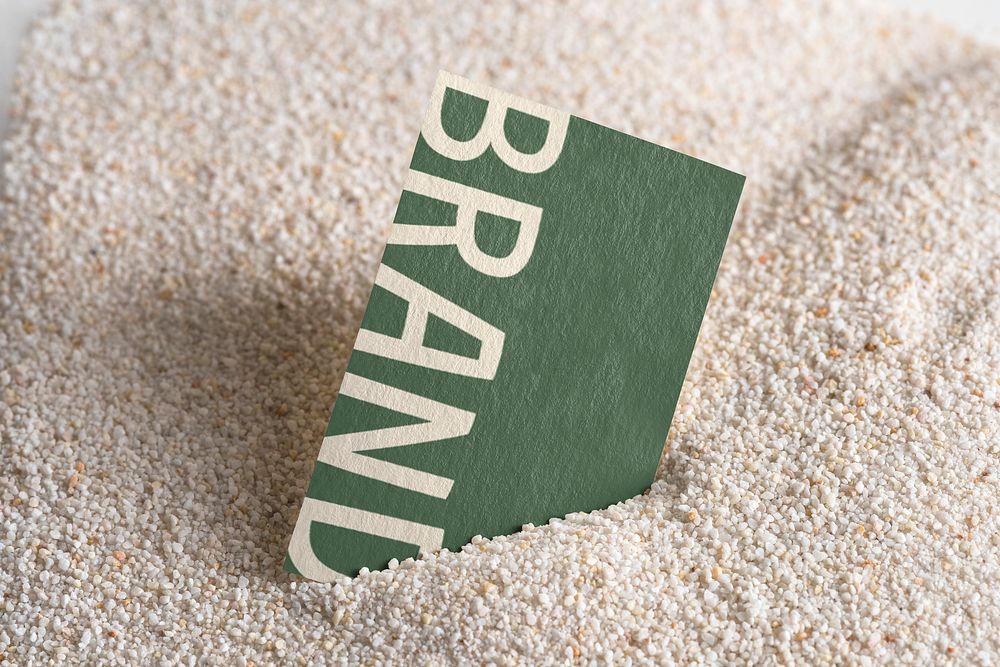 Business card mockup on sand, editable text psd
