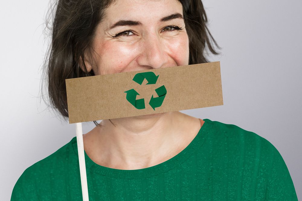 Conservative woman holding recycle symbol flag