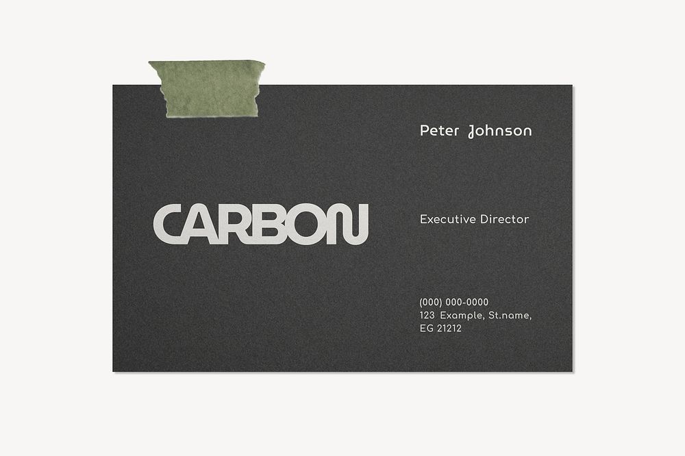 Carbon business card taped on a wall
