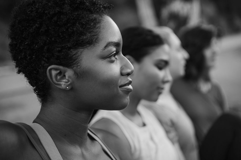 Female athletics stretching, black and white photo