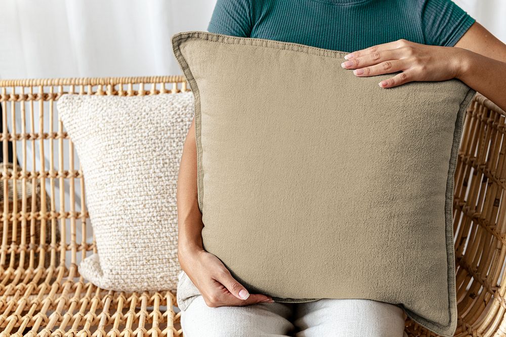 Woman holding beige pillow  photo