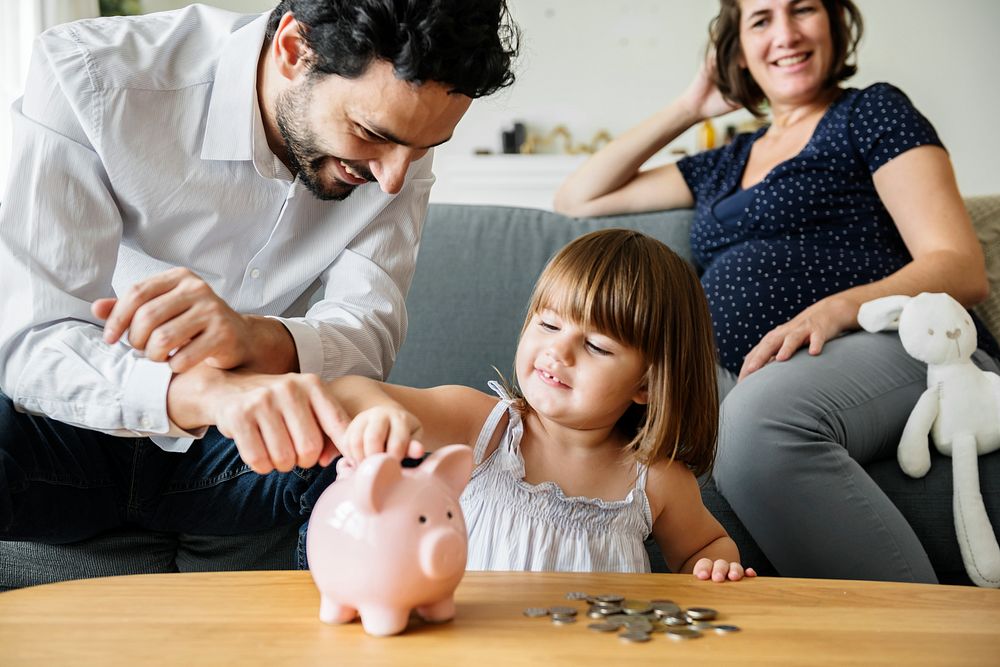 Family finance, saving money in piggy bank