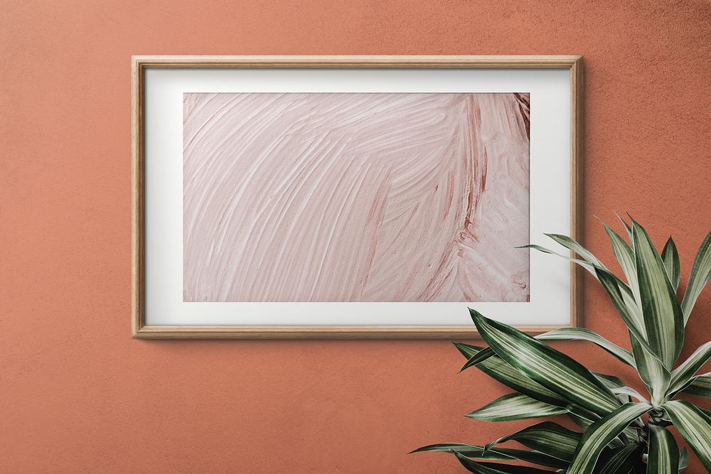 Wooden frame mockup on an orange wall