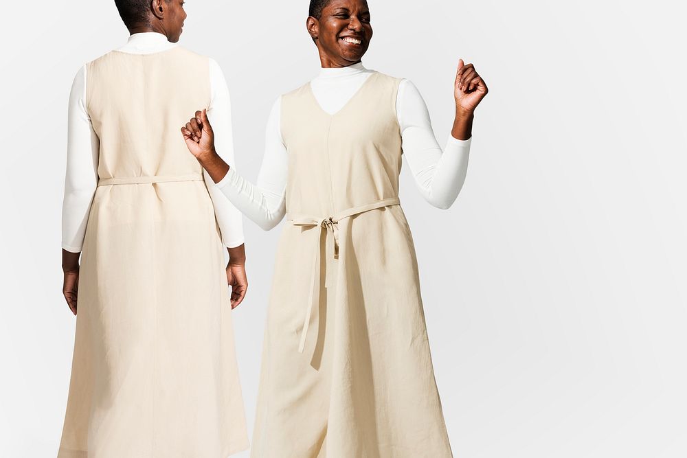 African American woman wearing beige dress  for apparel ad 