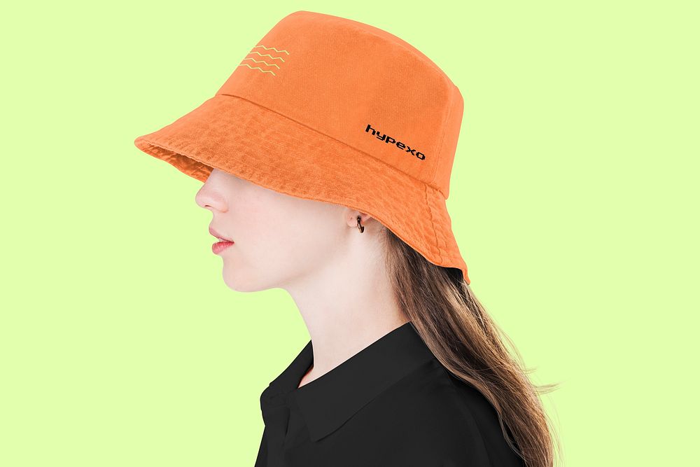 Female model wearing orange bucket hat