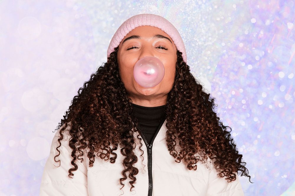 African American woman blowing bubble gum