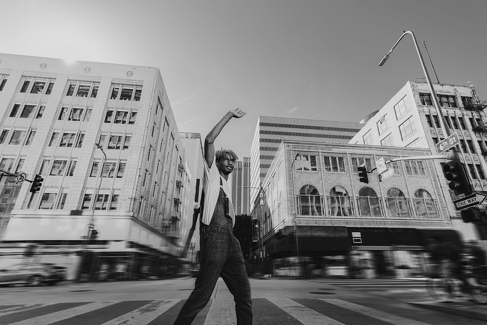 Urban fashion, African American man crossing road photo