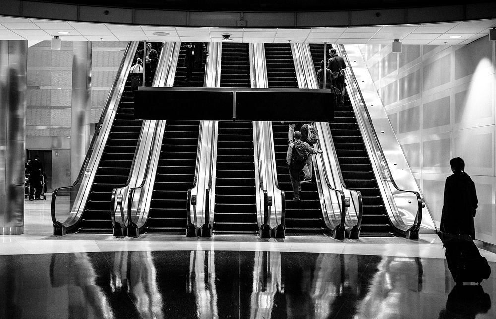 Airport escalator, gray photo