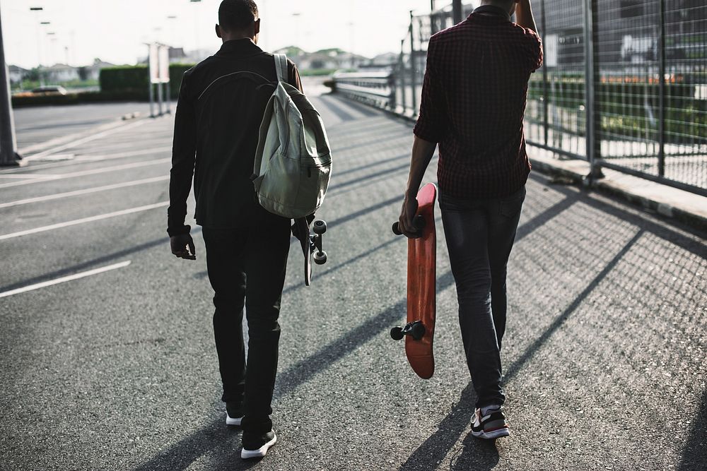 Men carrying skateboarders, hobby, lifestyle photo