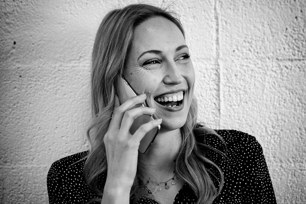 Happy woman talking on the phone