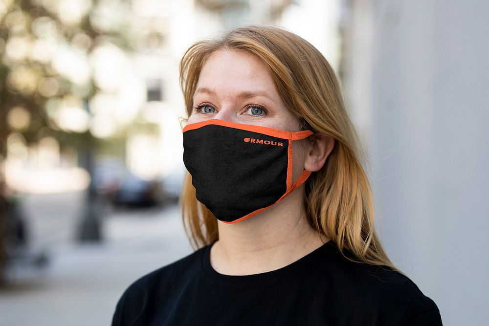 Blonde woman wearing mask in city, new normal photo