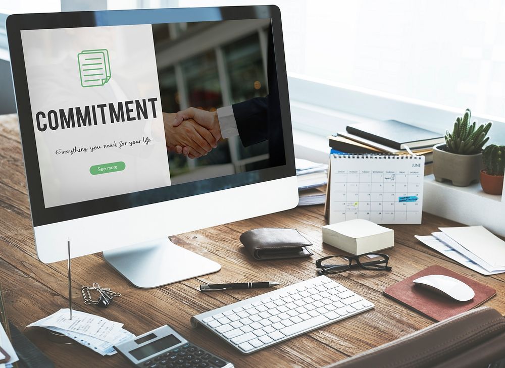 Commitment word on business handshake background